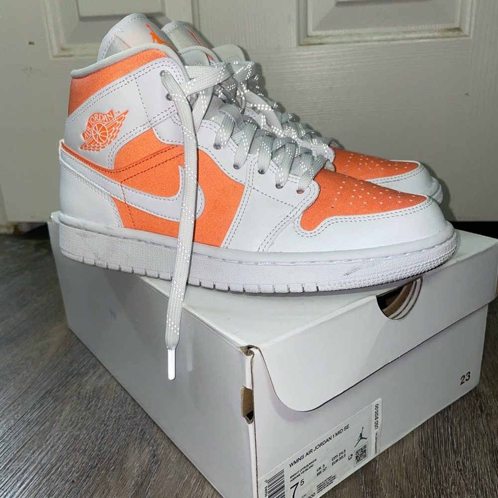 Women’s Jordan 1s white/reflective orange size US 7.5